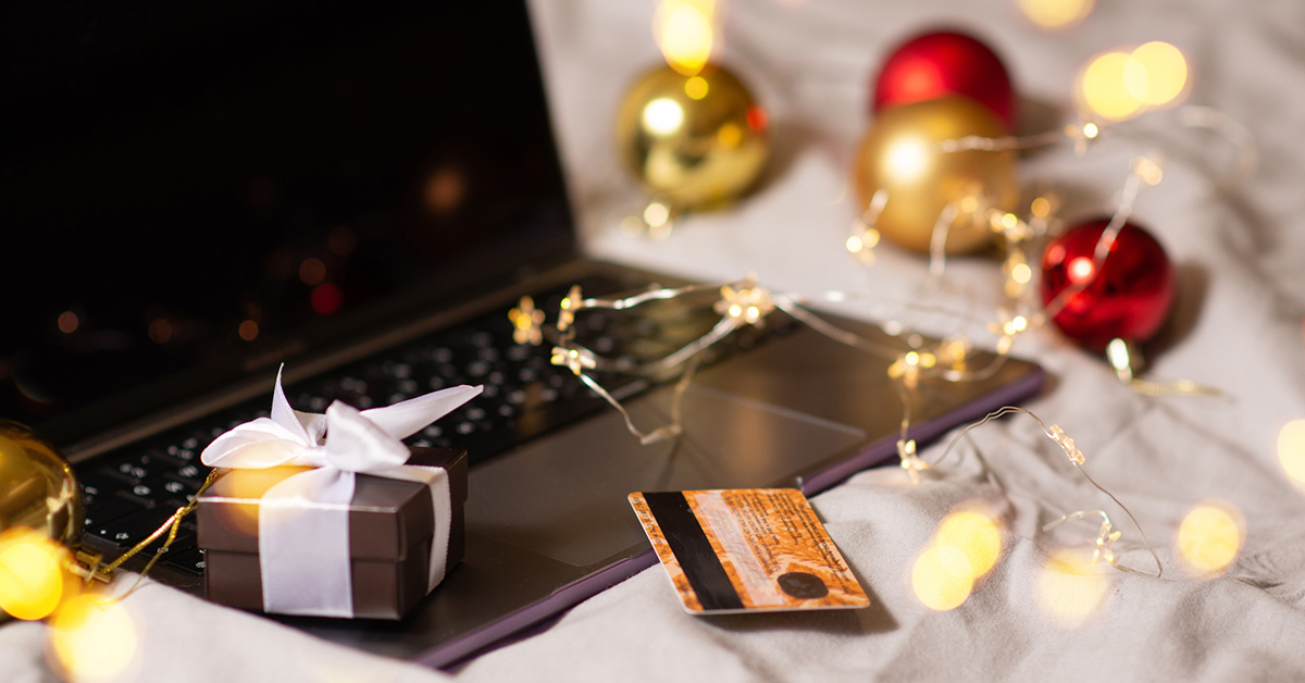 Laptop and holiday shopping scene