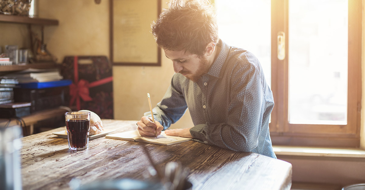 Man journaling to reduce stress