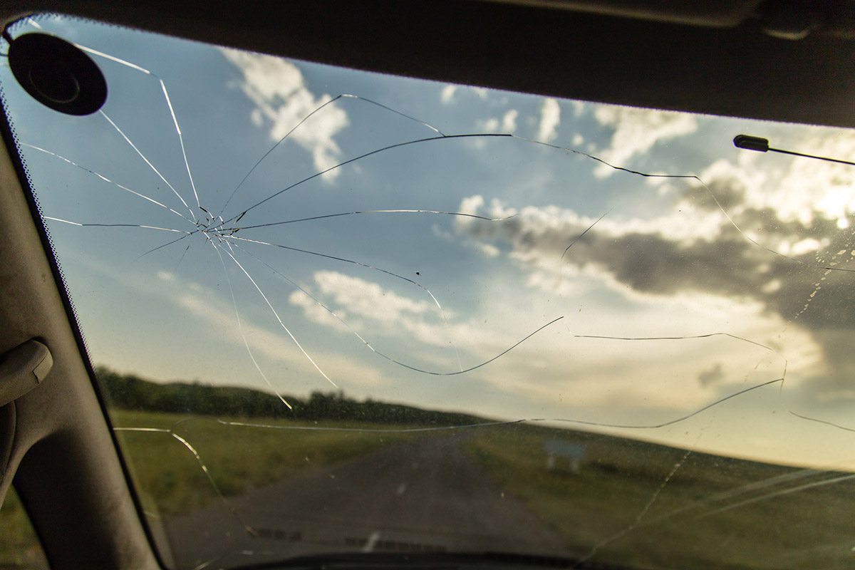 View from car driver's side of a cracked windshield